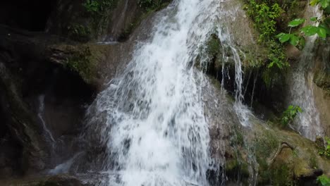 Waterfall-falling-down-in-the-middle-of-the-forest