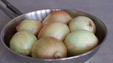 Stainless-Pan-With-Unpeeled-White-Onions