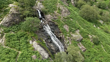 Drone-aerial-footage-of-the-Taylor-Gill-Force-Waterfall-at-Borrowdale,-Seathwaite-and-is-one-of-the-highest-waterfalls,-in-the-National-Park-Lake-District-United-Kingdom