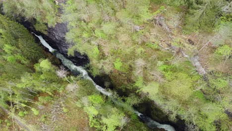 Aerial-view-of-famous-Bordalsgjelet-gorge-in-Voss-Norway---Birdseye-clip-follow-river-stream-down-valley