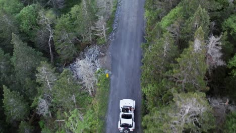 Aerial-drone-headshot-following-the-jeep-in-stowe-forest-road,-Vermont