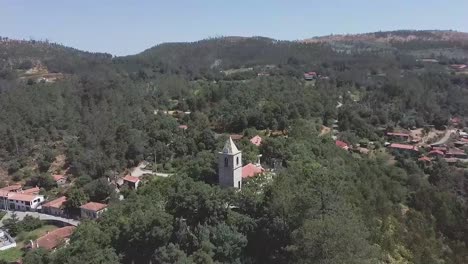 Aerial-view-of-a-portuguese-church-in-the-village-of-Macieira-de-Alcoba,-Águeda,-Portugal