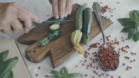 Cut-a-courgette-on-a-wooden-board