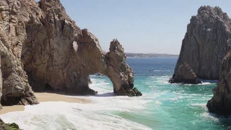 Aerial-drone-shot-of-waves-crashing-on-sea-cliffs-in-Cabo-San-Lucas-Mexico-1