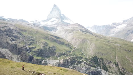 Tilt-up,-Reveal-of-Cervin-famous-mountain-in-Zermatt-for-tourism,-Swiss-alps,-nature-landscape,-drone-aerial-view