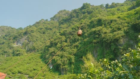 Freshly-Picked-Fruit-coming-Down-In-Baskets-On-One-Of-The-Multiple-Ziplines-At-The-Side-Of-The-Mountain,-Vietnam