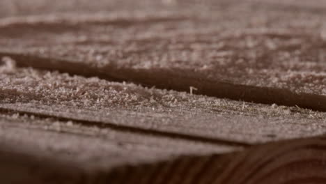 Sawdust-On-A-Cutting-Wooden-Board.-Macro,-Closeup