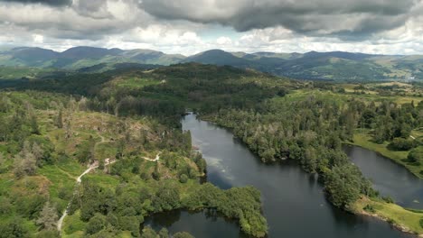 Drone-Aerial-footage-of-Tarn-Hows-in-the-Lake-District-National-Park-England-United-Kingdom-on-a-beautiful-sunny-summer-day