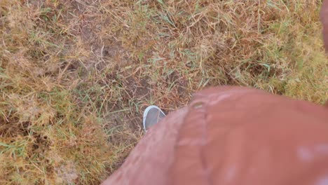 Close-Up-A-Man-Walking-Through-Thick-Savanna-Grass