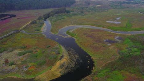 Aerial-Drone-View-Overlooking-Waterways-in-slow-descent-into-swamp