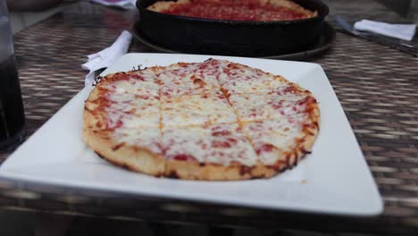 Thin-crust-pizza-at-Lou-Malnati's-Pizzeria-in-Evanston,-Illinois-in-slow-motion