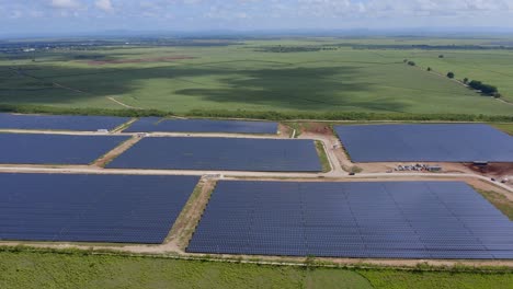 Wide-Panoramic-Aerial-View-Over-Brand-New-Built-Solar-Panels-Farm-in-Dominican-Republic-Parallax-Shot
