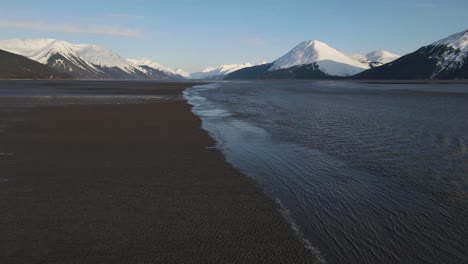 Aerial-shot-of-the-bore-tide-coming-in-on-Alaska's-Turnagain-Arm