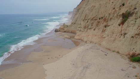 Flying-Along-Cliffs-As-Marine-Layer-Blows-In-California-Beach-Drone