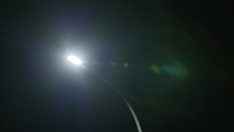 Lens-flare-of-a-street-light-at-night-in-a-quiet-neighbourhood-in-New-Zealand