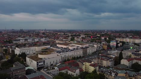 Thunderstorm-clouds-gather-over-shopping-center-Boulevard
Smooth-aerial-view-flight-panorama-overview-drone
of-Berlin-steglitz-germany-at-summer-sunset-August-2022