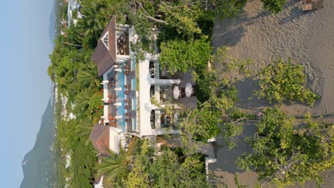 Aerial-vertical-flyover-luxury-CASA-COLONIAL-with-swimming