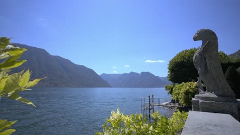 Timelapse-at-lake-como-in-the-backyard-of-famous-Villa-Balbiaono-with-eagle-statue-and-moorings