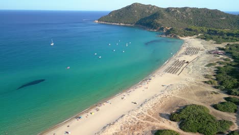 Spectacular-aerial-image-in-Sardinia-Italy,-Villasimius-beach-with-few-people