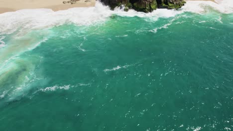 Aerial-drone-shot-of-waves-crashing-on-sea-cliffs-in-Cabo-San-Lucas-Mexico-2