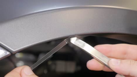 Close-Up-Cutting-Transparent-Film-on-Car's-Exterior