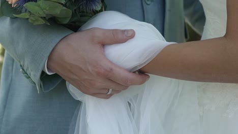Wedding-couple-holding-each-others-hands
