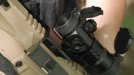 Detail-slow-motion-shot-of-rifle-scope