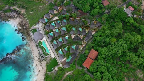 aerial-circling-overhead-pool-villas-on-cliff-at
