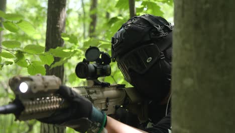 Slow-motion-tactical-army-guy-brings-gun-up