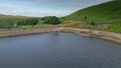 Landscape-Drone-aerial-footage-of-Yorkshire-countryside-valleys-moorland-and-reservoir-dam-wall