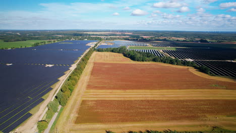 Huge-Solar-Panel-Field-In-Summer---aerial-panoramic