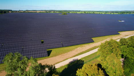 Aerial-View-Of-Large-Industrial-Solar-Power-Energy-Farm---drone-shot