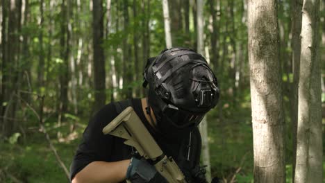 Slow-motion-Tactical-guy-in-forest-looking-around
