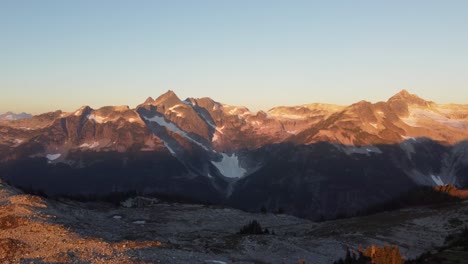 Beautiful-Sunset-Aerial-Pan-of-Snow-Capped-Hazy-Mountain-Landscape-from-Mount-Brew-Canada-BC-4K