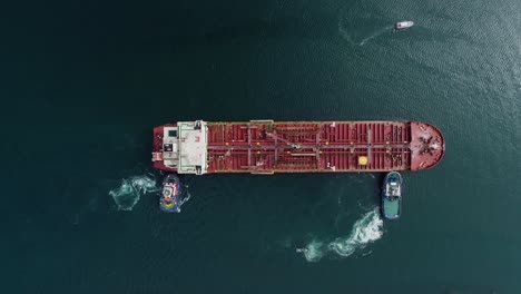 Aerial-view-above-boats-pushing-an-empty-cargo