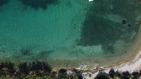 Top-down-view-on-the-beautiful-turquoise-water-of-the-Adriatic-Sea-in-a-secluded-part-of-the-Brac-island,-Croatia