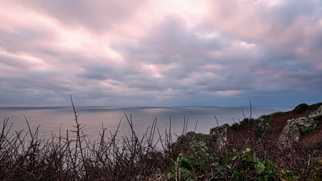 Hyper-lapse-shot-of-clouds-movement-above-sea-in-rocky-European-coast
