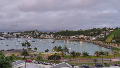Day-to-night-timelapse-of-traffic-in-Noumea,-New-Caledonia,-boats-on-Orphelinat-Bay