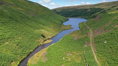 Aerial-Drone-footage-of-Yorkshire-countryside-with-valleys-moorland-and-reservoir-lake,-water