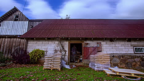Storing-large,-heavy-bags-of-wood-pellets-in-a-shed-for-winter-use---time-lapse