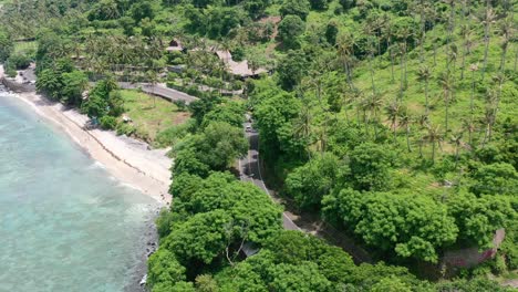 Tropical-aerial-coastline-road-in-Senggigi-Lombok-Indonesia-with-beautiful-turquoise-ocean