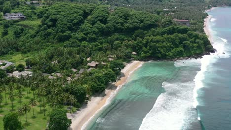 Pristine-white-sand-beach-with-turquoise-ocean-at-Kerandangan-in-Senggigi-Lombok-on-sunny-day,-aerial