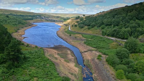 Aerial-footage-of-Yorkshire-countryside-with-valleys-moorland-and-reservoir-lake,-water