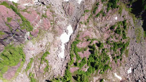 Aerial-Top-Down-Fly-Forward-of-Alpine-Rocky-Summit---Mackenzie-Range,-Vancouver-Island,-BC,-Canada