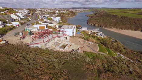 Aerial-shot-steel-frame-construction-overlooking-seaside-in-Cornwall-4