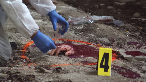 Forensic-detective,-taking-a-blood-or-DNA-sample-from-the-scene-of-a-horrific-crime