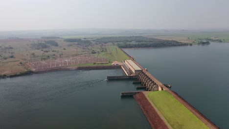 Drone-view-of-hydroelectric-power-plant-on-paranapanema-river,-artificial-lake,-transmission-station,Brazil