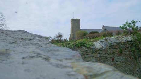 Church-spire-steeple-tower-background-of-green-village-in-Cornwall