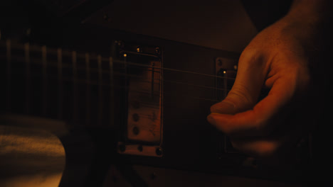 Close-up-of-fingers-playing-electric-guitar
