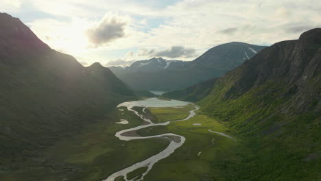 Scenic-Jotunheim-valley-with-river-snaking-through,-dramatic-landscape